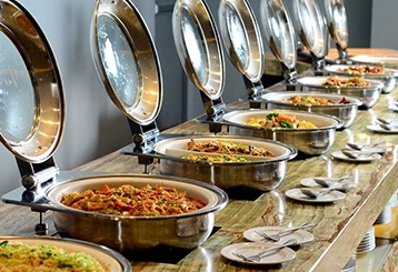 Professional stall designers creating custom displays for catering services at trade shows to boost visibility.