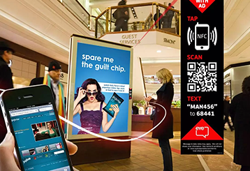 Modern tech stall setup at Broadway Mall with screens and demos for app and digital promotions