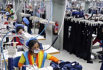 Expert stall designers creating custom displays for textiles and garments exhibitions to enhance brand visibility.