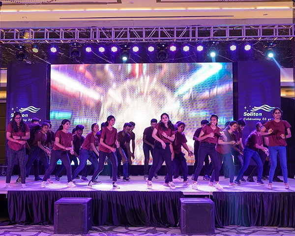 Corporate event organizers managing a grand corporate conference with high-tech audio-visual setups.