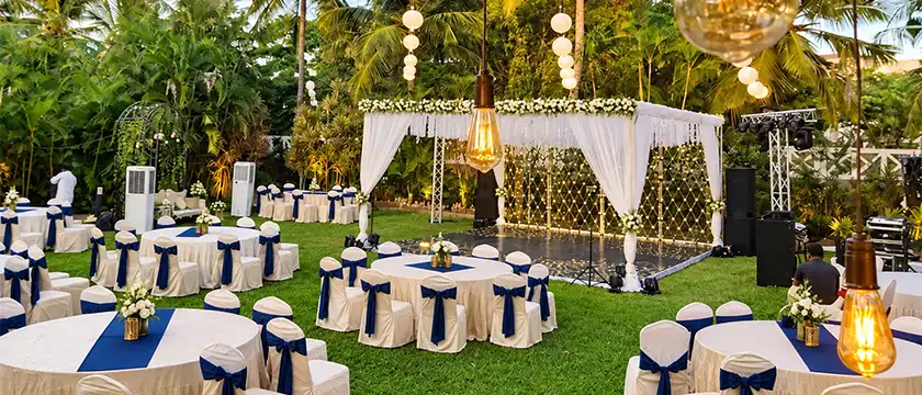 Farm wedding celebration with outdoor decorations, seating and venue arrangements in Erode