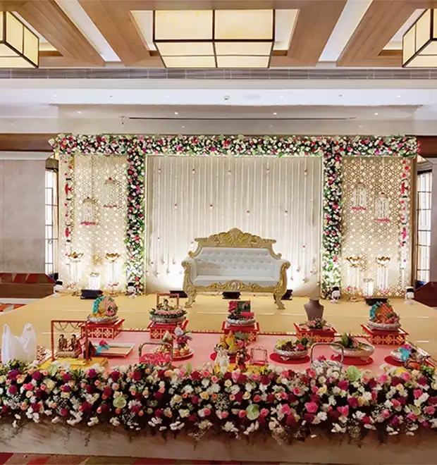 Grand marriage function with traditional decorations, stage setup and guest arrangements in Erode