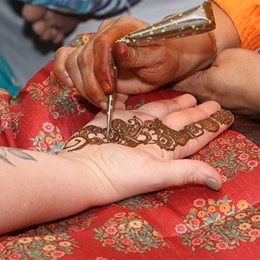 Mehndi ceremony with traditional decorations, seating and celebration arrangements for wedding events