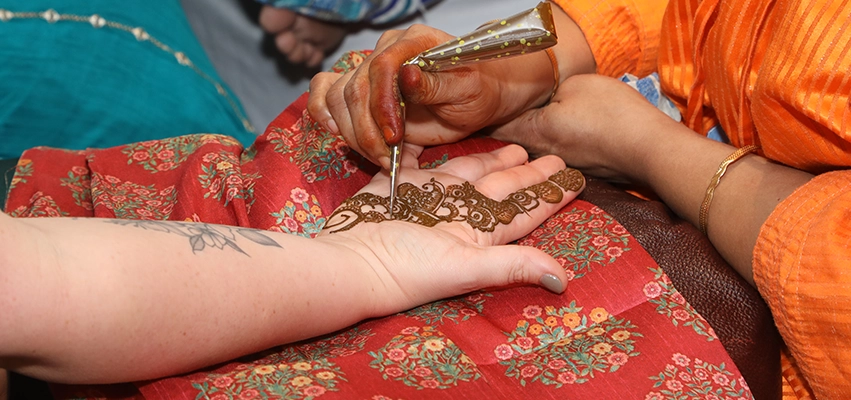 Vibrant mehendi function decoration with colorful themes and cultural event styling