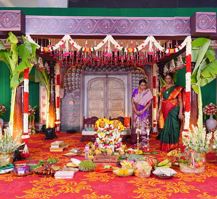 Neatly arranged pooja area with sacred items, flowers and decorations for traditional wedding rituals.