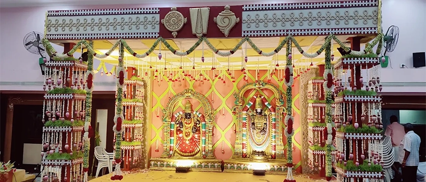 Temple mandap wedding with traditional decorations, ceremonial setup and family arrangements in Erode