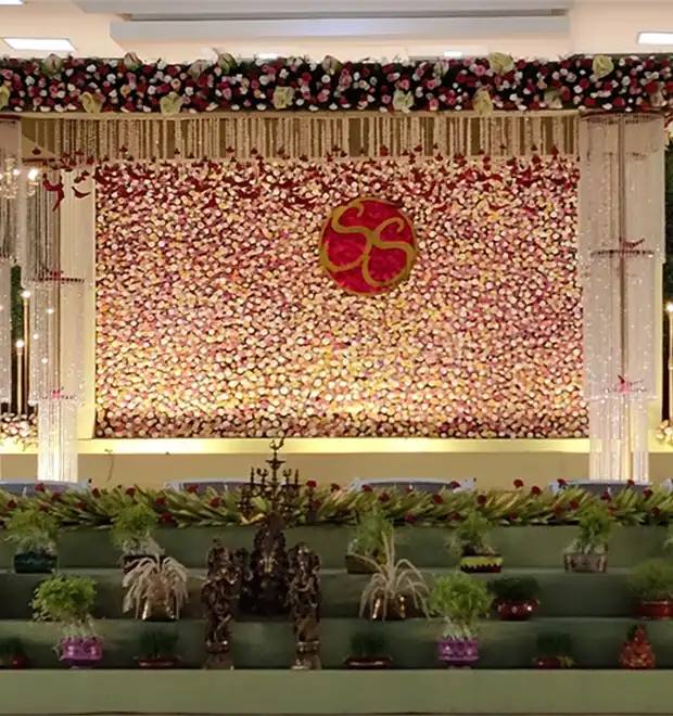 Wedding reception celebration with decorated stage, seating and event arrangements in Erode