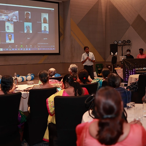 Collaborative corporate training session with team-building activities and modern presentation setups.